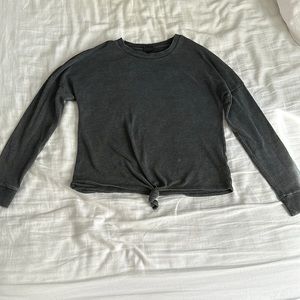 This is a gray tied at the bottom cute jacket